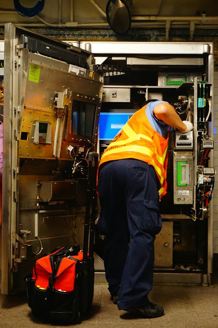 Technician repairing equipment